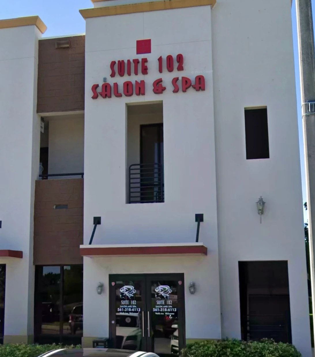 Suite 102 Salon & Spa storefront building with signage